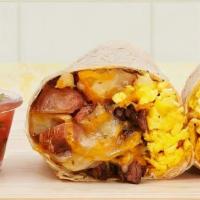 Carne Asada Breakfast Burrito · Two scrambled eggs, carne asada, hash browns, and melted cheese wrapped in a fresh flour tor...