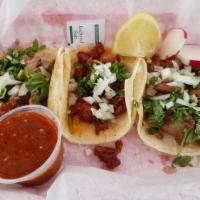 Taco · Choice of meat, cilantro, onion, and salsa.