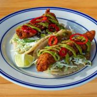 Crispy Fish Taco · 2 tacos per order, served on our made-to-order corn tortillas, spicy cabbage slaw, avocado s...