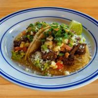 Steak Taco · 2 tacos per order, served on our made-to-order corn tortillas, asada-style skirt steak, guac...