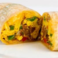 Machaca Burrito · Start with slow cooked shredded beef then we add green and red peppers, onions, cheddar- jac...