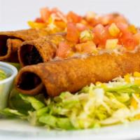 Flautas · Our slow cooked shredded beef rolled in a flour tortilla and fried, comes with shredded lett...