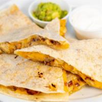 Grilled Chicken Quesadilla · Large flour tortilla filled with melted cheddar- jack cheese and grilled chicken comes with ...