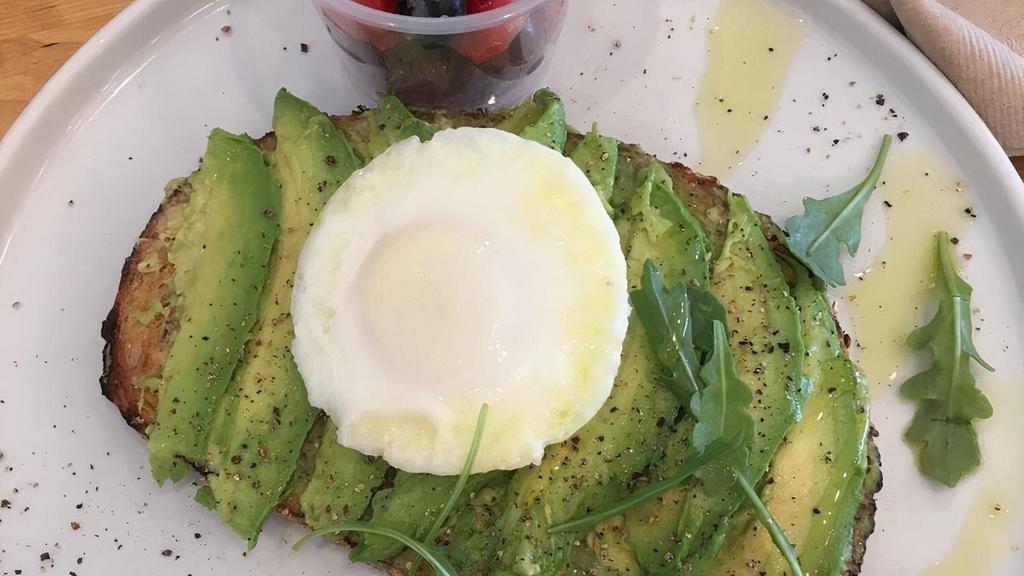 California Avocado Toast · Avocado spread & slices, cracked pepper, sea salt, arugula, light oil, & light balsamic drizzle. Served with side of fruit.  Add bacon, egg, gluten free for an additional charge.