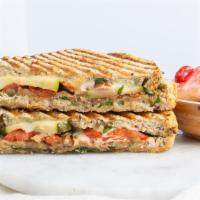The Stacked Veggie · Grilled eggplant, zucchini, spinach, onion, tomato, with arugula, provolone, avocado, and sp...