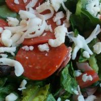 Antipasto Salad · Romaine & iceberg lettuce, tomato, onions, cucumber, black olives, ham, salami, pepperoni an...