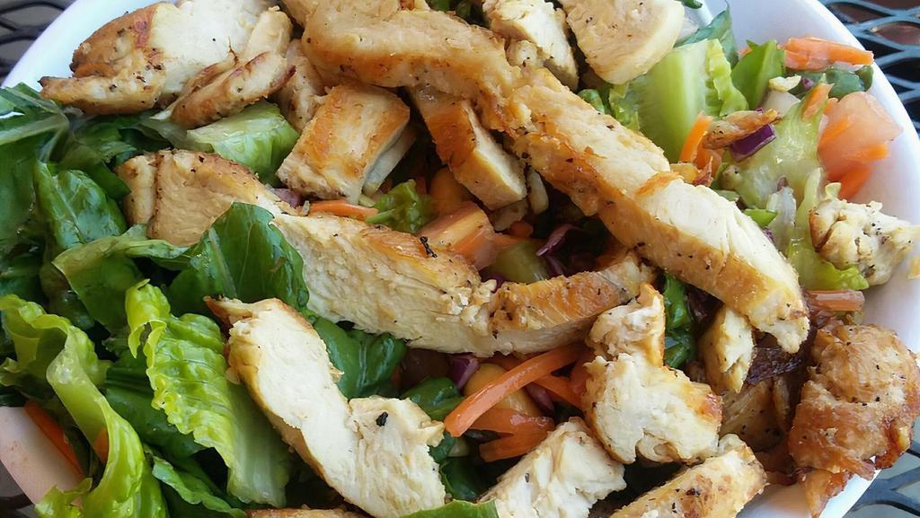 Chinese Chicken · Romaine & iceberg lettuce, tomato, onions, carrots, peanuts, cabbage, cilantro, chicken, and ginger dressing.