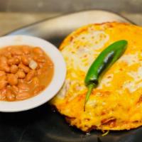 Huevos Rancheros · Gluten-free. Warm corn tortillas topped with three over medium eggs, spicy ranchero sauce, c...