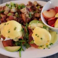 Eggs Benedict · Crispy english muffin with grilled thick cut smoked ham, poached eggs, and hollandaise sauce...