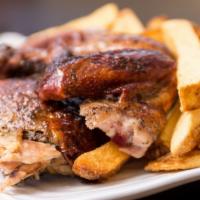 1/2 Chicken With Two Sides · Rotisserie Wood fire chicken.  Four pieces include Breast, Wing, Thigh and Leg.  Served with...