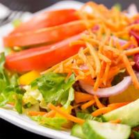 Salad · Our fresh Garden Salad.  Romaine lettuce mixed with purple cabbage and carrots.  Topped with...