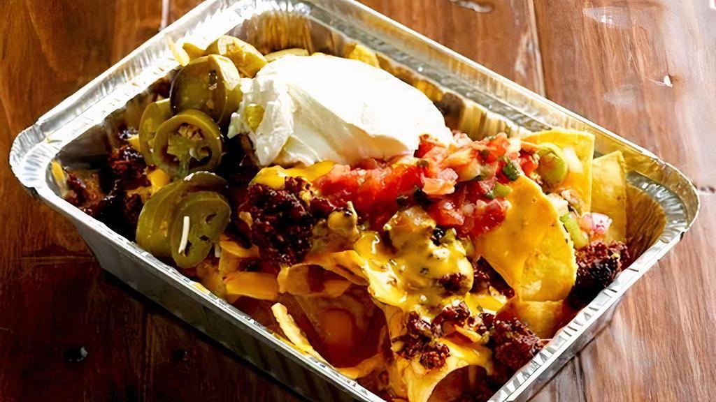 Jimmy Nachos · Zesty ground beef topped with nacho cheese sauce, sour cream, salsa, and jalapenos.