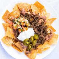 La Villa Nachos · Chips, your choice of meat, your choice of cheese, beans, pico de gallo, sour cream, and jal...