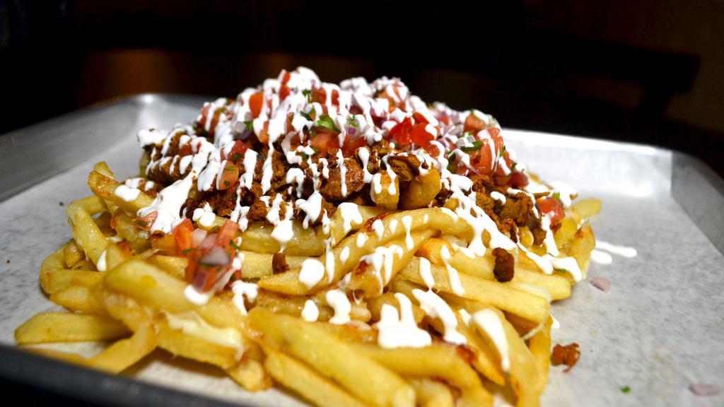 Monster Fries/Asada Fries · French fries served with melted mozzarella cheese, pico de gallo, sour cream, and your choice of Asada, Chicken, Carnitas or Adobada. Please refer to our list of meats for descriptions. Street Fries style also available. Adobada Fries Special $6.50