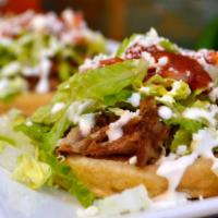 Street Sopes · Two sopes ( thick corn disks), topped with  whole beans, your choice of meat, lettuce, onion...