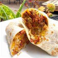 Vegetarian Breakfast Burrito · NEW! Made with scrambled eggs, our signature Papas con Soy Chorizo, veggie franks, and melte...