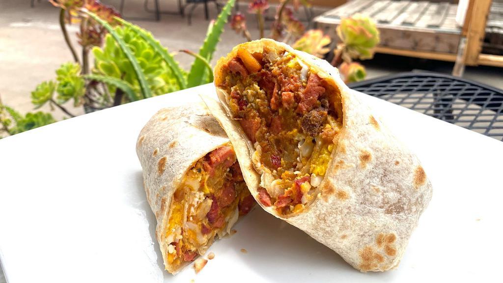 Breakfast Burrito · NEW! Made with scrambled eggs, our signature Papas con Soy Chorizo, beef franks, and melted mozzarella cheese.