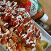 Street Fries · French fries served with melted mozzarella cheese, pico de gallo, sour cream, diced hotdog s...