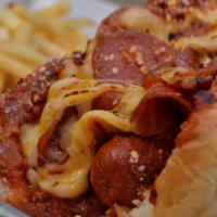 Pizza Dogo · A gourmet 1/4 lb. hot dog wrapped in bacon in a homemade bun, topped with cheese, marinara s...