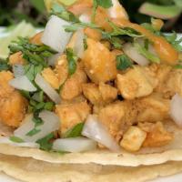 Chicken Taco · Marinated chicken breast; chopped and grilled, topped with onions, cilantro and a mild sauce.
