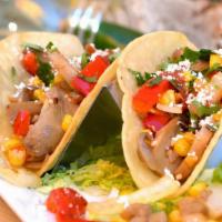 All-Veggie Taco · Street taco in a corn tortilla stuffed with corn, grilled bell peppers, mushrooms, and onion...