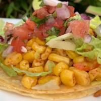 Esquite Taco · Served with grilled corn and red bell pepper, spices, Tajin; topped with lettuce, pico de ga...