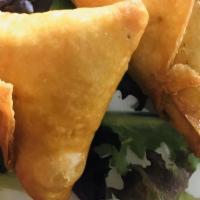 Meat Samosa · Triangular Shaped Savory Pastries Filled With Ground Beef & peas.