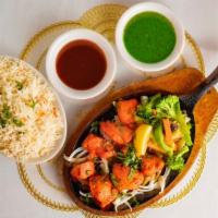 Chicken Tikka · Tender, boneless pieces of chicken, flavored with spices and cooked on a skewer in the Tando...