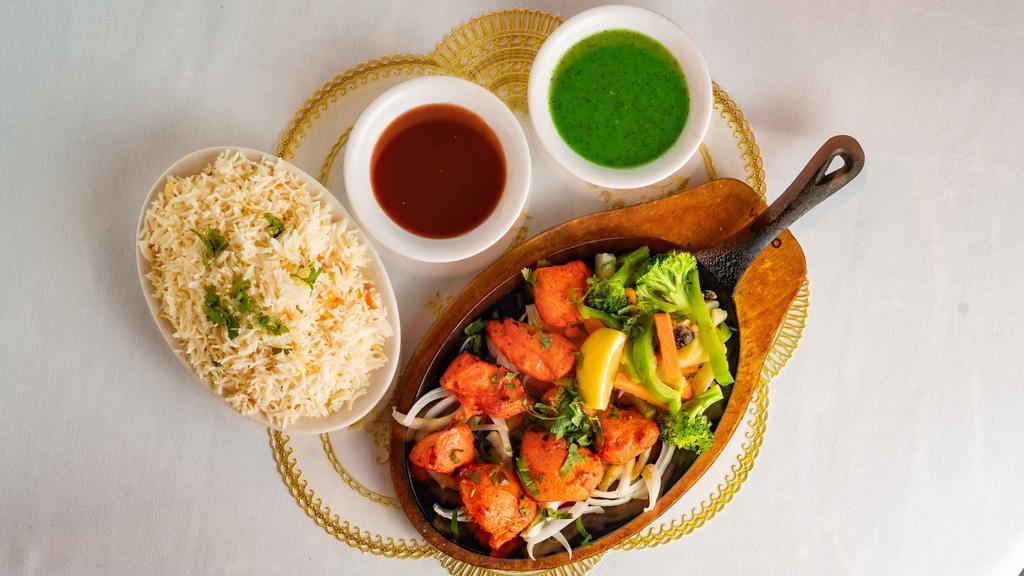 Chicken Tikka · Tender, boneless pieces of chicken, flavored with spices and cooked on a skewer in the Tandoor.