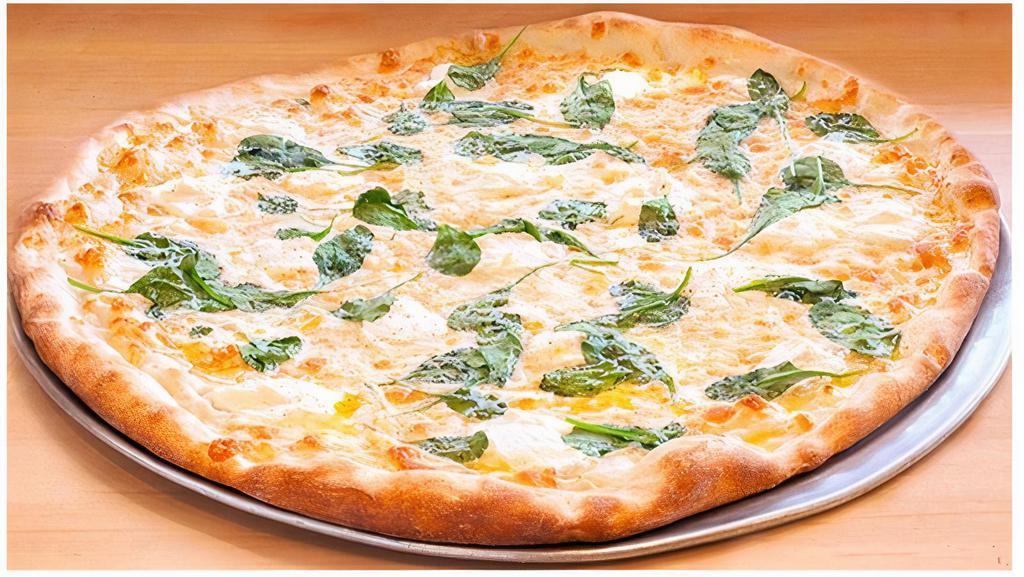 White Pizza · All natural mozzarella & whipped ricotta cheese, fresh spinach & garlic, aromatic olive oil, house-made fresh dough (no tomato sauce).