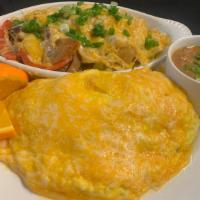 Texas Omelet · Smoked beef sausage with diced trio bells, onions,  green onions folded into 3 eggs topped w...