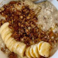 Oatmeal · Oatmeal with banana, granola, honey and your choice of milk or water.