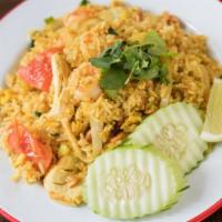 Pineapple Fried Rice · Curry fried rice, choice of meat, fresh pineapple, egg, cashew nut, raisin, onion, and bell ...