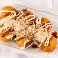 Takoyaki · Ball shaped Japanese dumpling filled with dice octopus topped with sweet sauce, mayonnaise, ...