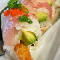 Umami Roll · Shrimp tempura and avocado topped with yellowtail, masago, green onions, and creamy sauce