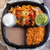 Famous Fajitas Plate · With sautéed onions, colorful bell peppers, tomato, sour cream, guacamole with rice, beans, ...