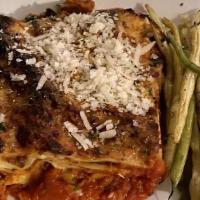 Lasagna · house-made noodles, house-made beef ragu, mozzarella, parmigiano,  béchamel sauce 
with gree...