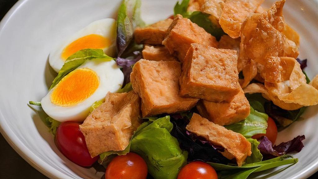Tofu Salad · Deep Fried Firm Tofu, Boiled Egg, Mixed Greens Salad, Grape Tomatoes, Persian Cucumber, Carrots, Crispy wonton Strips, Creamy Peanut  Dressing