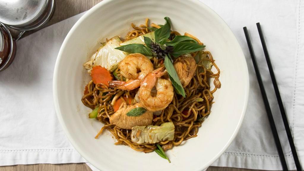 Jungle Noodles · Soba noodles, bold brown sauce, garlic, Thai chilies, chicken, shrimp, red bell peppers, mushroom, cabbage, carrots, finger root, key lime leaves, Thai basil.