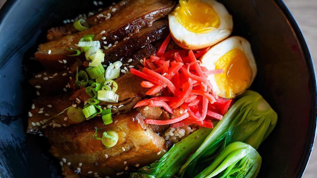 Sumo Rice · Japanese Style Braised Pork Belly, Jasmine Rice, Soy sauce soft boiled egg, Braising Juice, Bok Choy, Pickled ginger, Chopped green onions, Sesame Seeds.