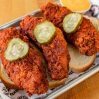 Jumbo Tenders · Three jumbo chicken tenders with your choice of heat, served on white bread with pickles. In...