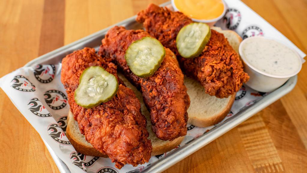 Jumbo Tenders · Three jumbo chicken tenders with your choice of heat, served on white bread with pickles. Includes your choice of housemade ranch or fuego sauce.