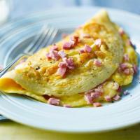 Decadent Ham And Cheese Omelette · Sunny 3-egg omelette with ham, mushrooms, diced onion, and your choice of cheese. Side of to...