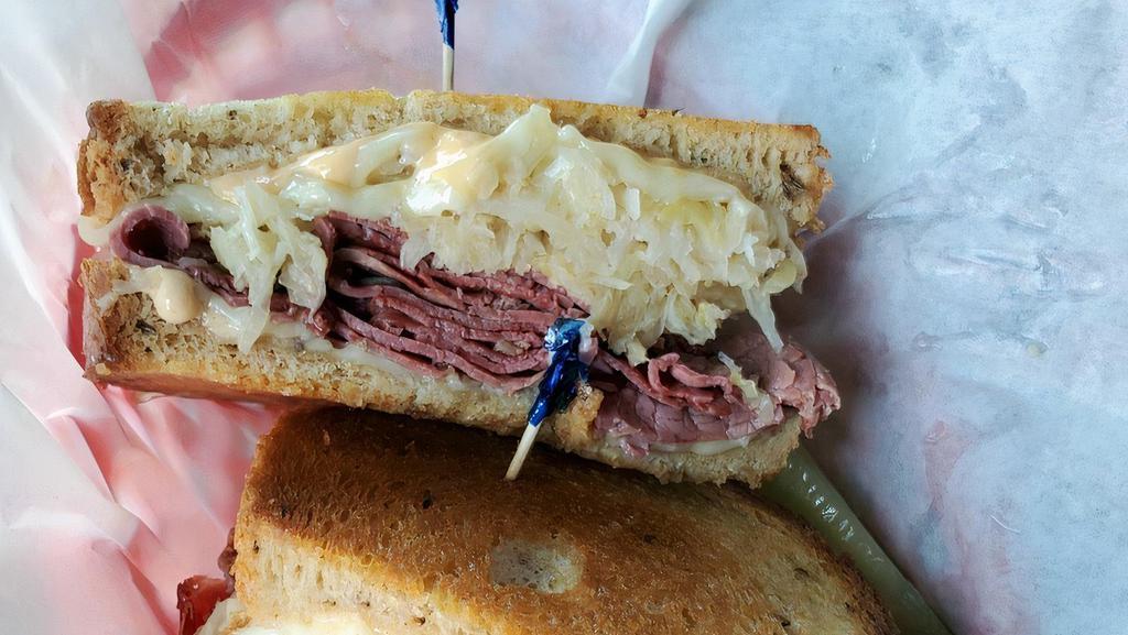 Uncle Reuben'S Reuben · Corned beef topped with sauerkraut. Swiss cheese and thousand island dressing grilled on rye bread.