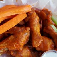 Large Wings(16 Pcs.) · Crispy chicken wings dipped in your choice of sauce choose up to two flavors. Served with ou...