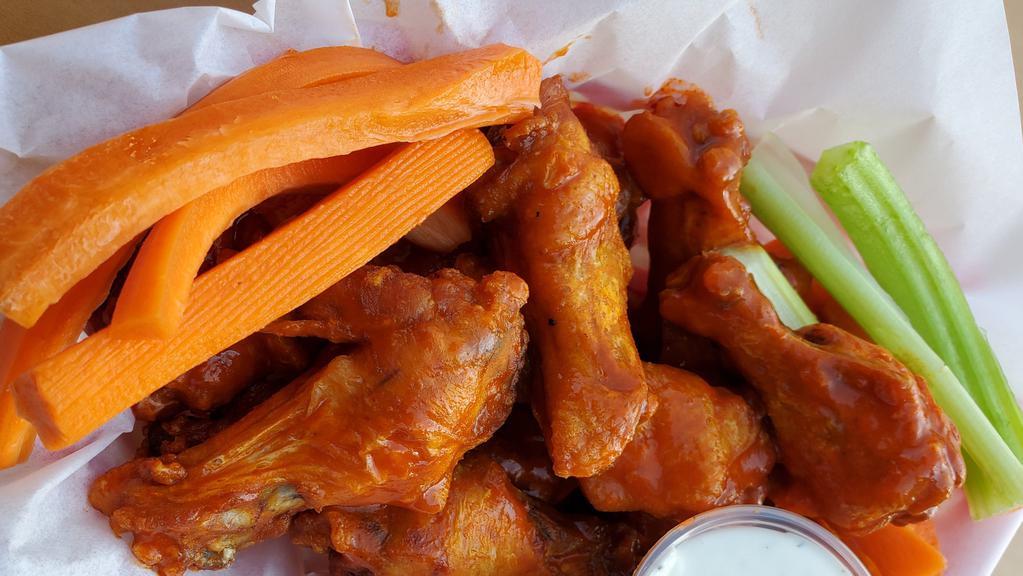 Large Wings(16 Pcs.) · Crispy chicken wings dipped in your choice of sauce choose up to two flavors. Served with our own ranch or blue cheese dressing and side of celery and carrots.
