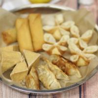 Small Bite Sampler · A combination of appetizers - four pieces of fried tofu, four spring roll, four pieces of cr...