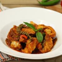 Spicy Catfish Fillet · Deep-fried fish fillet Sautéed with curry paste, chili, bell peppers, basil, pepper seed, an...