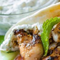 Chicken Gyro · Tender skewer of chicken , lettuce, tomatoes, onions, and special sauce wrapped in a freshly...