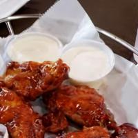 10 Pcs Bbq Wings  · 12 PCS chicken wings with BBQ sauce and Ranches on the side.